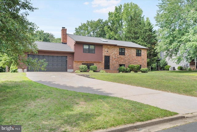 1215 Lorene Dr, Pasadena, MD 21122 - split foyer home featuring an attached garage, concrete driveway, a chimney, a front yard, and brick siding
