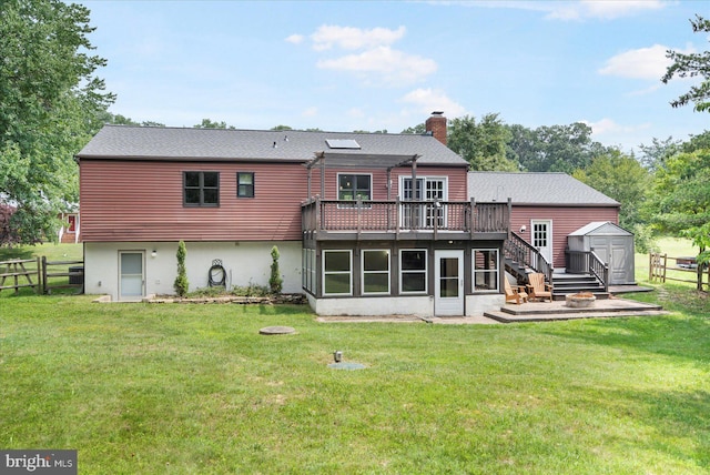 1215 Lorene Dr, Pasadena, MD 21122 - back of house with a storage unit, a deck, a chimney, stairway, and roof with shingles
