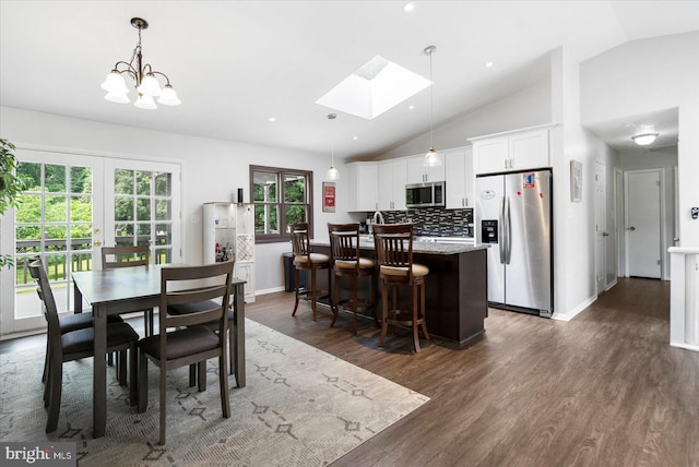 1215 Lorene Dr, Pasadena, MD 21122 - dining area with vaulted ceiling, a skylight, dark wood-type flooring, french doors, and recessed lighting