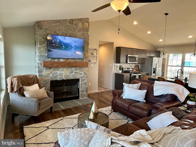 240 Howellsville Rd, Front Royal, VA 22630 - living room featuring dark wood-style flooring, ceiling fan, vaulted ceiling, a fireplace, and recessed lighting