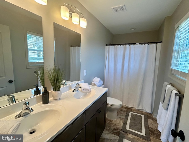 240 Howellsville Rd, Front Royal, VA 22630 - full bath featuring double vanity, curtained shower, and stone finish floors