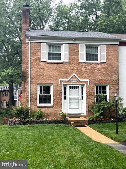 14861 Lambeth Sq, Centreville, VA 20120 - view of front of house with a chimney, brick siding, and a front yard