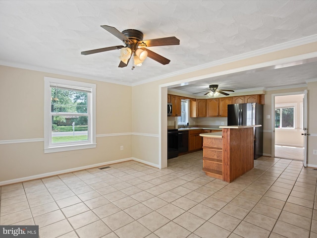 1440 Cedarhurst Rd, Shady Side, MD 20764 - kitchen with ceiling fan, light tile patterned flooring, light countertops, plenty of natural light, and ornamental molding