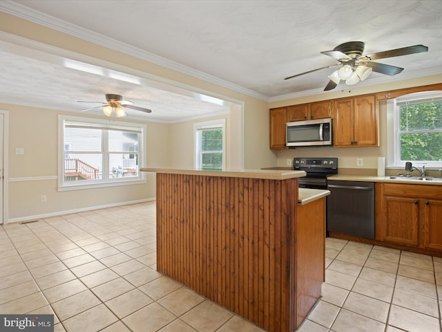 1440 Cedarhurst Rd, Shady Side, MD 20764 - kitchen featuring dishwashing machine, stainless steel microwave, ceiling fan, light tile patterned flooring, and crown molding