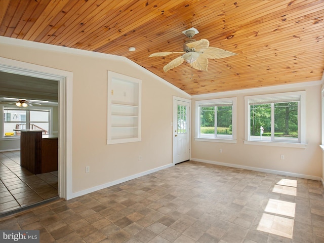 1440 Cedarhurst Rd, Shady Side, MD 20764 - spare room featuring wood ceiling, ceiling fan, vaulted ceiling, and stone finish floors