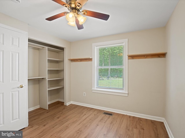 1440 Cedarhurst Rd, Shady Side, MD 20764 - unfurnished bedroom with light wood finished floors, a closet, and a ceiling fan