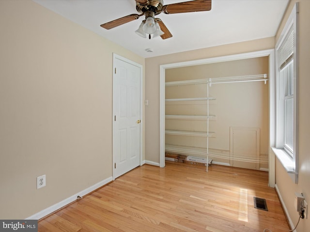 1440 Cedarhurst Rd, Shady Side, MD 20764 - unfurnished bedroom featuring light wood finished floors, ceiling fan, and a closet
