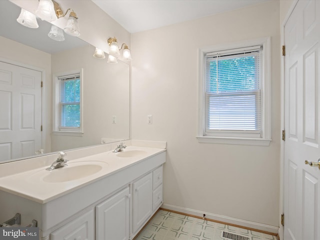 1440 Cedarhurst Rd, Shady Side, MD 20764 - bathroom featuring double vanity and baseboards