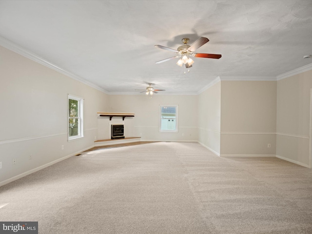 1440 Cedarhurst Rd, Shady Side, MD 20764 - unfurnished living room with a ceiling fan, a glass covered fireplace, crown molding, and carpet