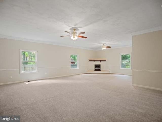 1440 Cedarhurst Rd, Shady Side, MD 20764 - unfurnished living room with ornamental molding, a ceiling fan, a fireplace with raised hearth, and carpet floors