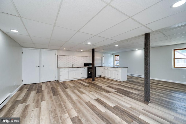 27 E Spring St, Frackville, PA 17931 - basement featuring a baseboard heating unit, light wood-style floors, a drop ceiling, and recessed lighting