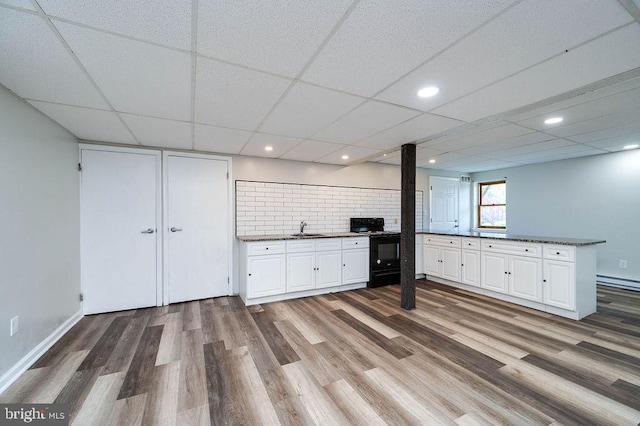 27 E Spring St, Frackville, PA 17931 - unfurnished living room featuring wood finished floors, recessed lighting, and a paneled ceiling