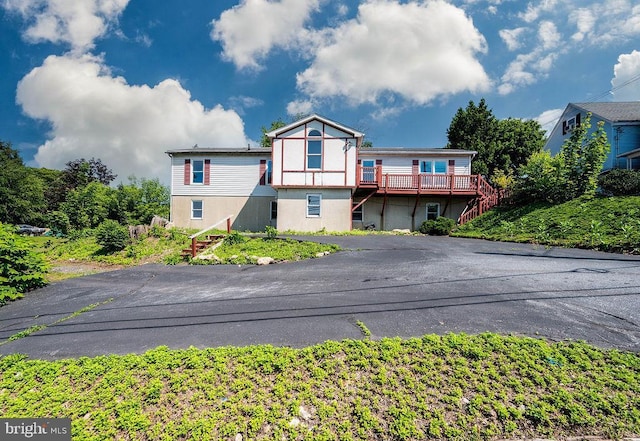 27 E Spring St, Frackville, PA 17931 - view of front of home with stairs, stucco siding, and driveway