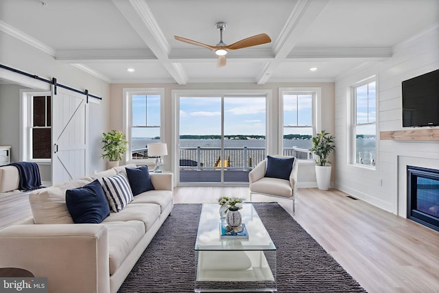 7108 River Drive Rd, Sparrows Point, MD 21219 - living room featuring a barn door, coffered ceiling, wood finished floors, beam ceiling, and ceiling fan