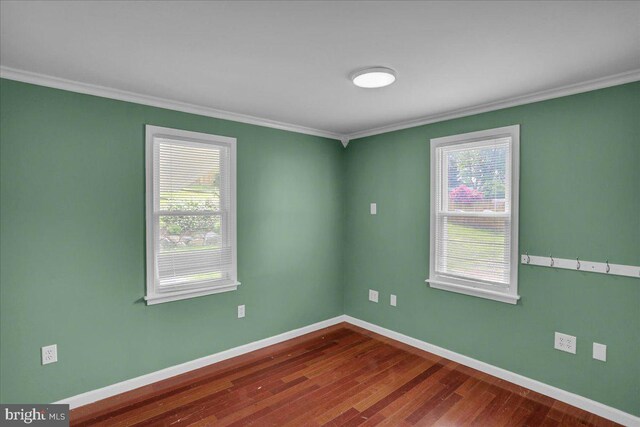 3629 Chestnut St, Reading, PA 19605 - spare room featuring crown molding and dark wood-style flooring