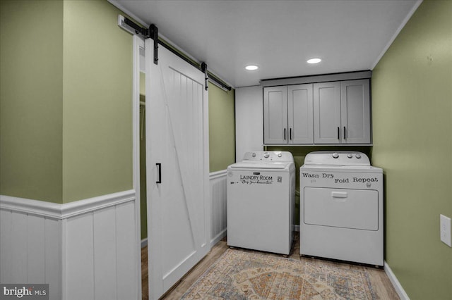 3629 Chestnut St, Reading, PA 19605 - washroom with washer and dryer, a barn door, wainscoting, light wood-style flooring, and recessed lighting
