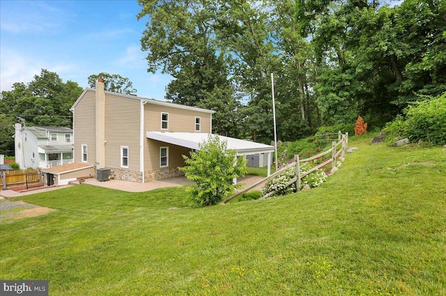3629 Chestnut St, Reading, PA 19605 - rear view of house featuring a chimney and a patio