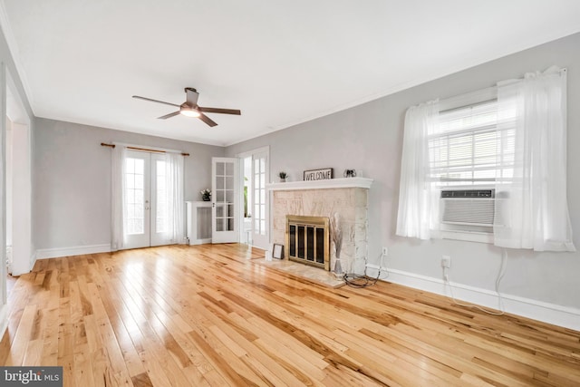 824 Lindale Ave, Drexel Hill, PA 19026 - unfurnished living room featuring hardwood / wood-style floors, ceiling fan, a fireplace, and french doors