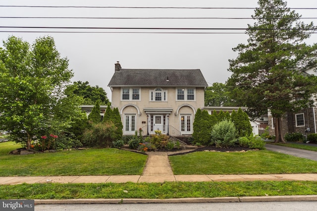 824 Lindale Ave, Drexel Hill, PA 19026 - colonial house with a front lawn, a chimney, and french doors