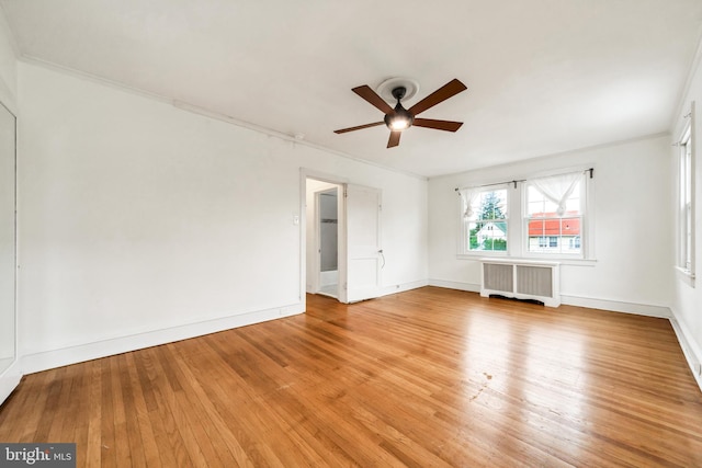 824 Lindale Ave, Drexel Hill, PA 19026 - empty room featuring radiator, a ceiling fan, light wood-style flooring, and crown molding