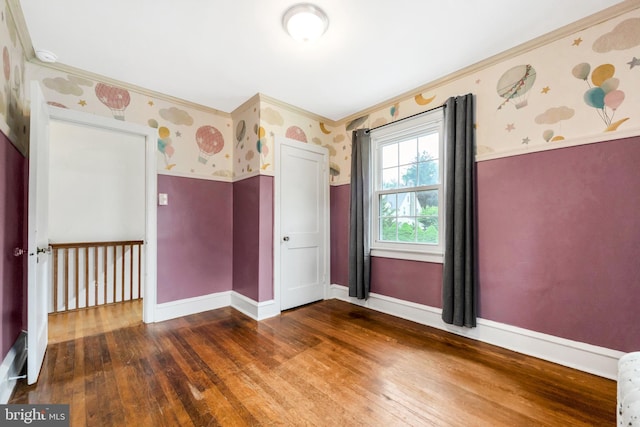 824 Lindale Ave, Drexel Hill, PA 19026 - unfurnished room featuring wallpapered walls, ornamental molding, and hardwood / wood-style floors