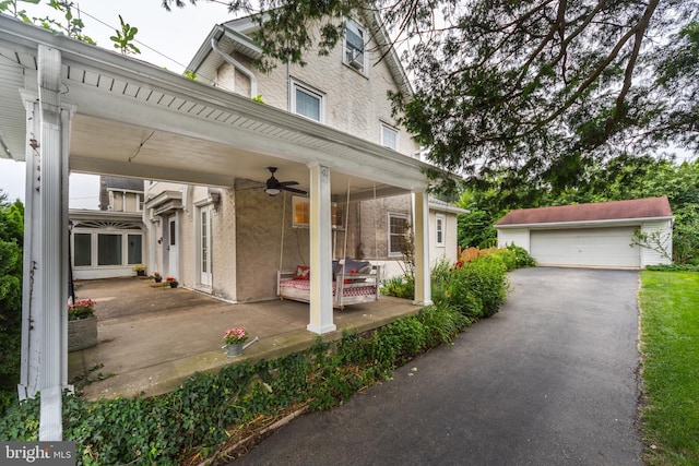 824 Lindale Ave, Drexel Hill, PA 19026 - view of patio / terrace with a ceiling fan, an outdoor structure, and a garage