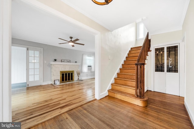 824 Lindale Ave, Drexel Hill, PA 19026 - unfurnished living room featuring wood finished floors, plenty of natural light, and stairs