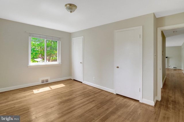 6005 Frederick St, Springfield, VA 22150 - unfurnished bedroom featuring wood finished floors and baseboards