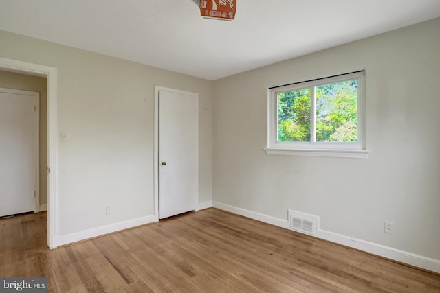 6005 Frederick St, Springfield, VA 22150 - empty room with light wood-type flooring and baseboards