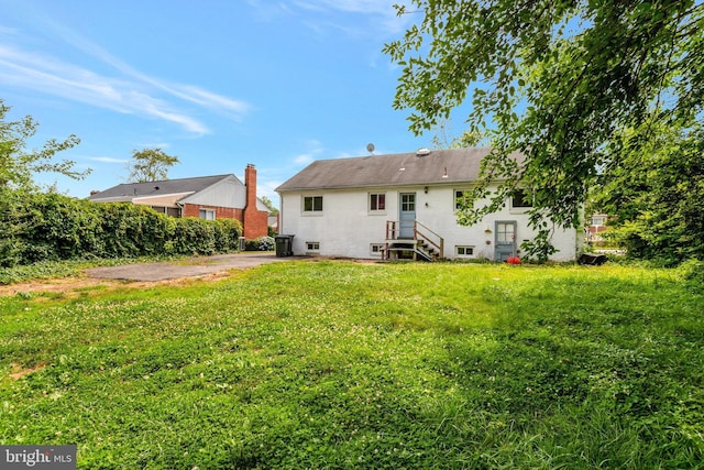 6005 Frederick St, Springfield, VA 22150 - rear view of property featuring a yard