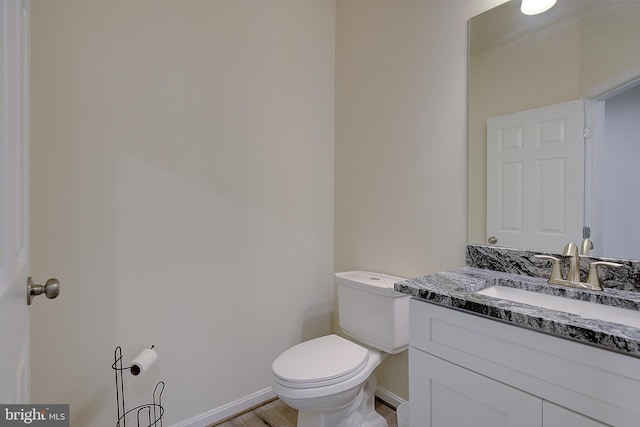8207 Elm Ln, Chesapeake Beach, MD 20732 - half bathroom with vanity and wood finished floors