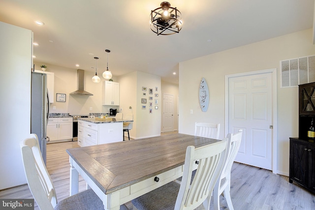 8207 Elm Ln, Chesapeake Beach, MD 20732 - dining area with light wood-type flooring and recessed lighting