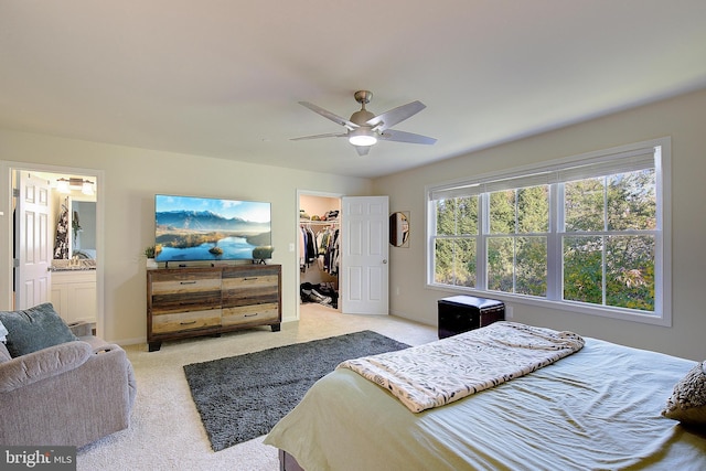 8207 Elm Ln, Chesapeake Beach, MD 20732 - bedroom with light colored carpet, a spacious closet, ensuite bathroom, a closet, and a ceiling fan