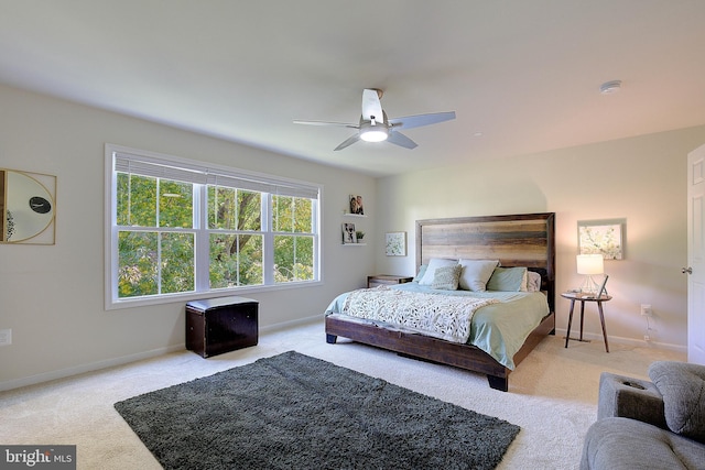 8207 Elm Ln, Chesapeake Beach, MD 20732 - carpeted bedroom with baseboards and a ceiling fan