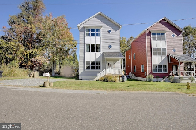 8207 Elm Ln, Chesapeake Beach, MD 20732 - view of front facade featuring a front lawn