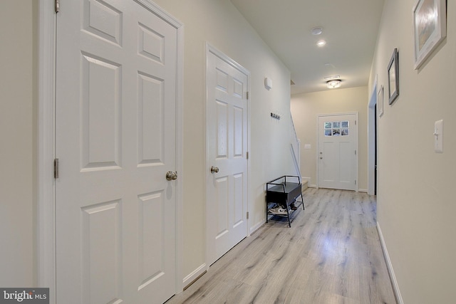 8207 Elm Ln, Chesapeake Beach, MD 20732 - corridor with light wood-style flooring and baseboards