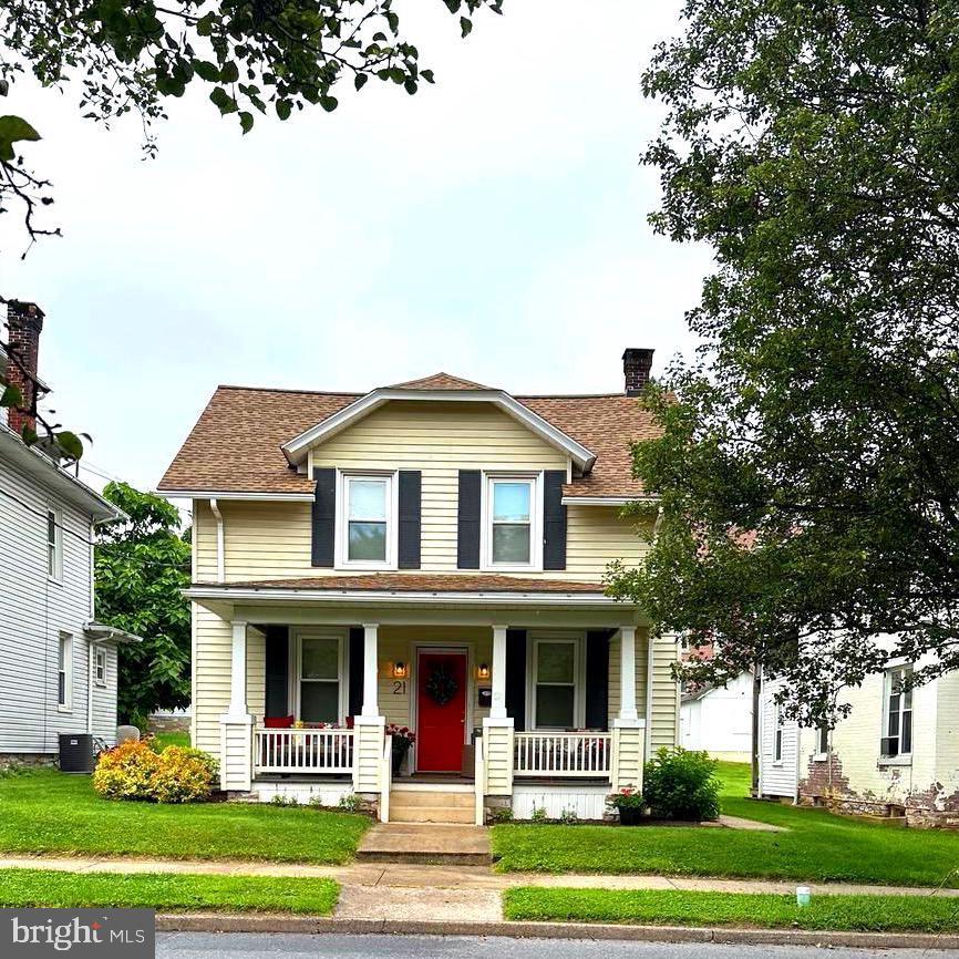 21 E Areba Ave, Hershey, PA 17033 - view of front of property featuring covered porch, a front yard, a chimney, and a shingled roof