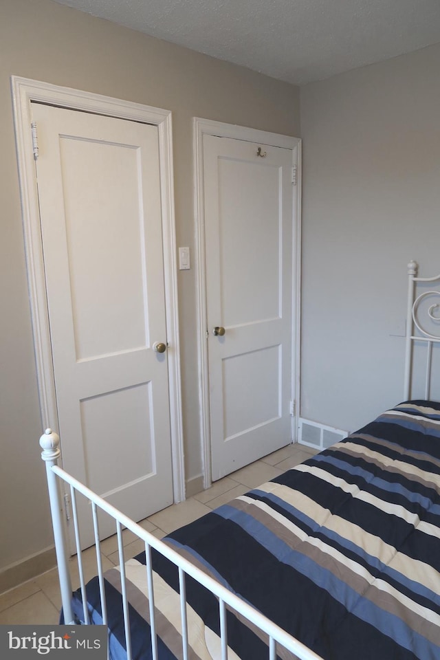 652 E Raymond St, Philadelphia, PA 19120 - bedroom with light tile patterned flooring