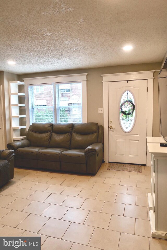 652 E Raymond St, Philadelphia, PA 19120 - entrance foyer featuring a textured ceiling and light tile patterned flooring