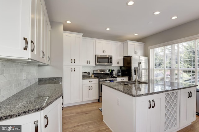 6362 Levtov Lndg, Alexandria, VA 22312 - kitchen with stainless steel appliances, recessed lighting, backsplash, white cabinetry, and light wood-type flooring