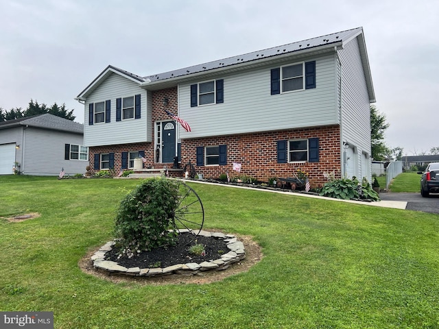10474 Mapleton Rd, Shippensburg, PA 17257 - split foyer home featuring brick siding, a garage, and a front yard