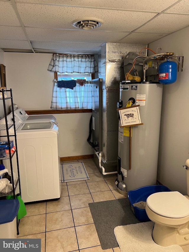 10474 Mapleton Rd, Shippensburg, PA 17257 - laundry area featuring water heater, light tile patterned floors, and heating unit
