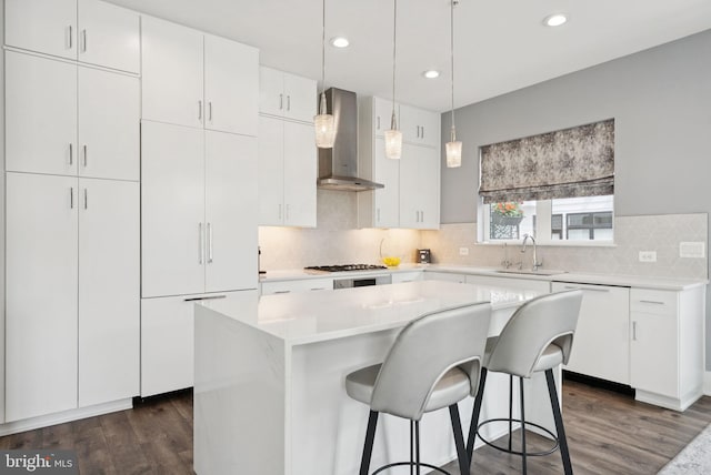 11336 Emerald Park Rd, Potomac, MD 20854 - kitchen featuring dishwasher, wall chimney range hood, dark wood finished floors, backsplash, and recessed lighting