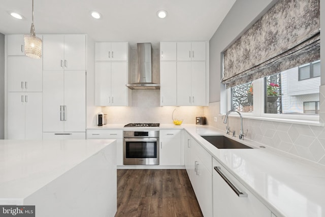 11336 Emerald Park Rd, Potomac, MD 20854 - kitchen with oven, wall chimney range hood, gas cooktop, tasteful backsplash, and dark wood-style floors