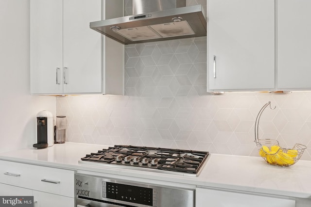 11336 Emerald Park Rd, Potomac, MD 20854 - kitchen featuring exhaust hood, oven, stainless steel gas cooktop, and white cabinets