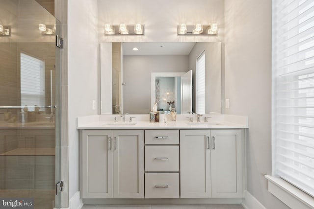 11336 Emerald Park Rd, Potomac, MD 20854 - bathroom with double vanity and baseboards