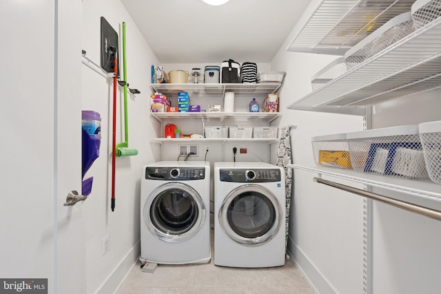 11336 Emerald Park Rd, Potomac, MD 20854 - laundry room featuring independent washer and dryer and light tile patterned flooring