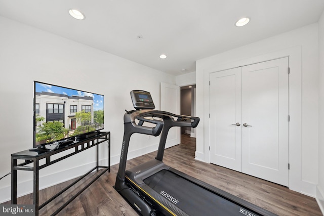 11336 Emerald Park Rd, Potomac, MD 20854 - workout area with wood finished floors and recessed lighting