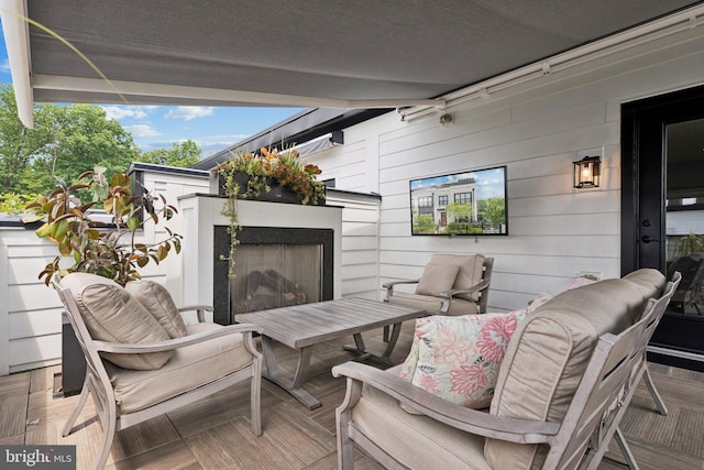 11336 Emerald Park Rd, Potomac, MD 20854 - view of patio featuring an outdoor living space with a fireplace