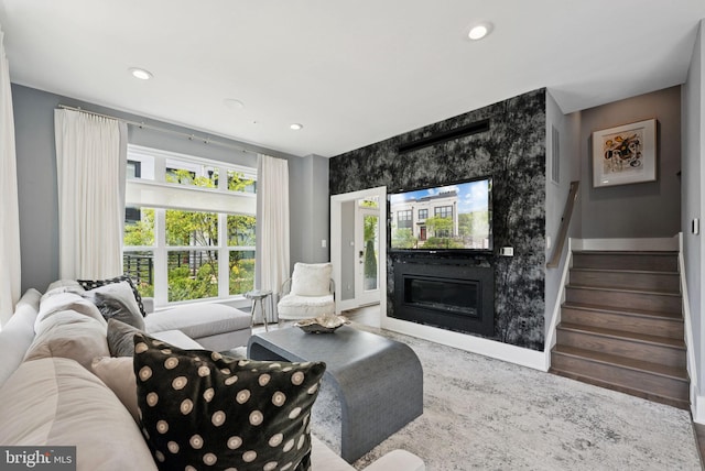 11336 Emerald Park Rd, Potomac, MD 20854 - living room featuring a large fireplace, stairway, and recessed lighting